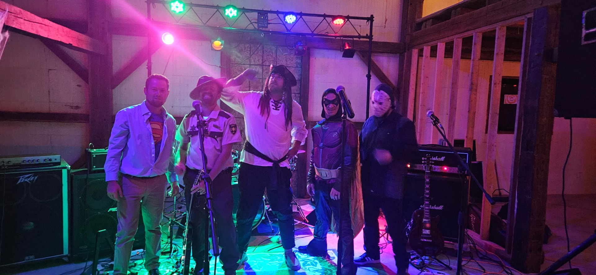 The band in Halloween costumes on the barn stage
