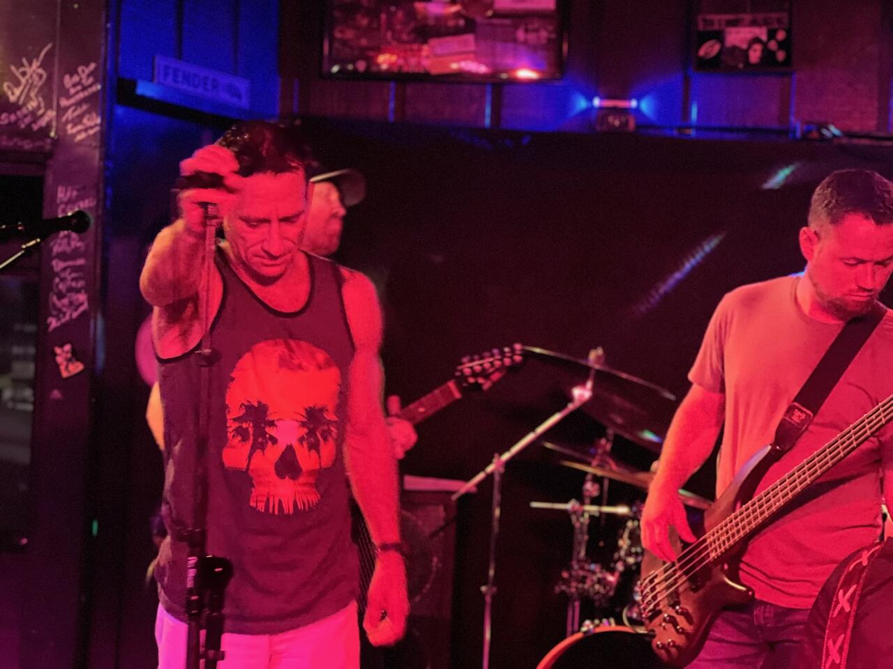 Singer and bassist locked in during a set